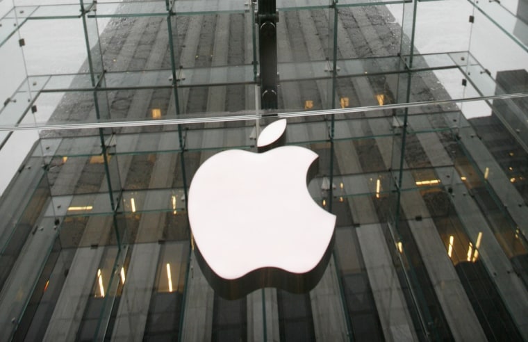 Image: File photo of the Apple logo hanging at the entrance to the Apple store on Fifth Avenue in New York